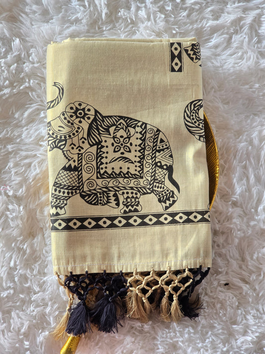 Tissue set saree with black elephant print on border and pallu