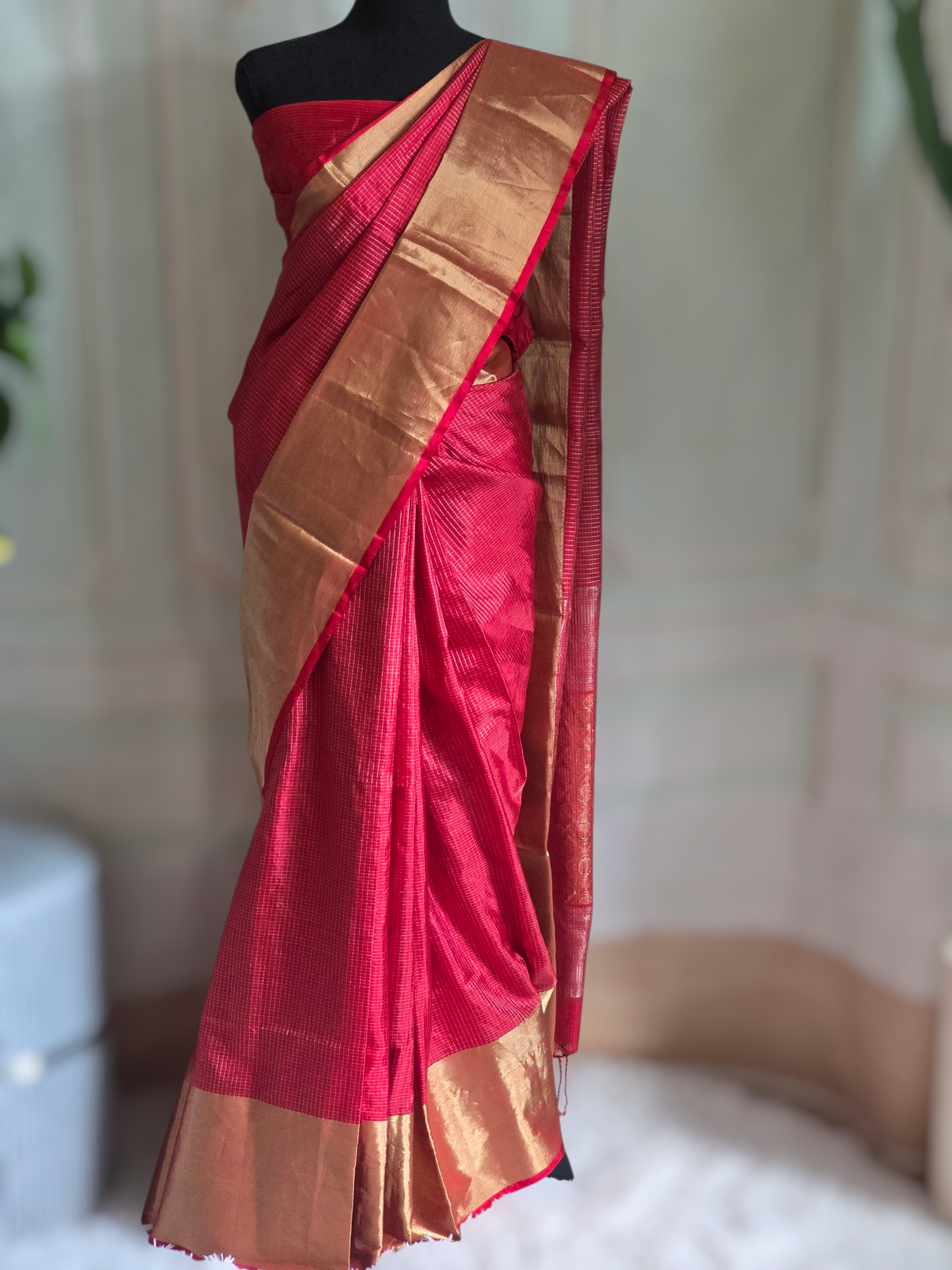 Kancheepuram soft silk check design saree with copper zari-stitched blouse