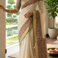 Premium cotton kerala saree (dark green) with floral block print design-stitched blouse