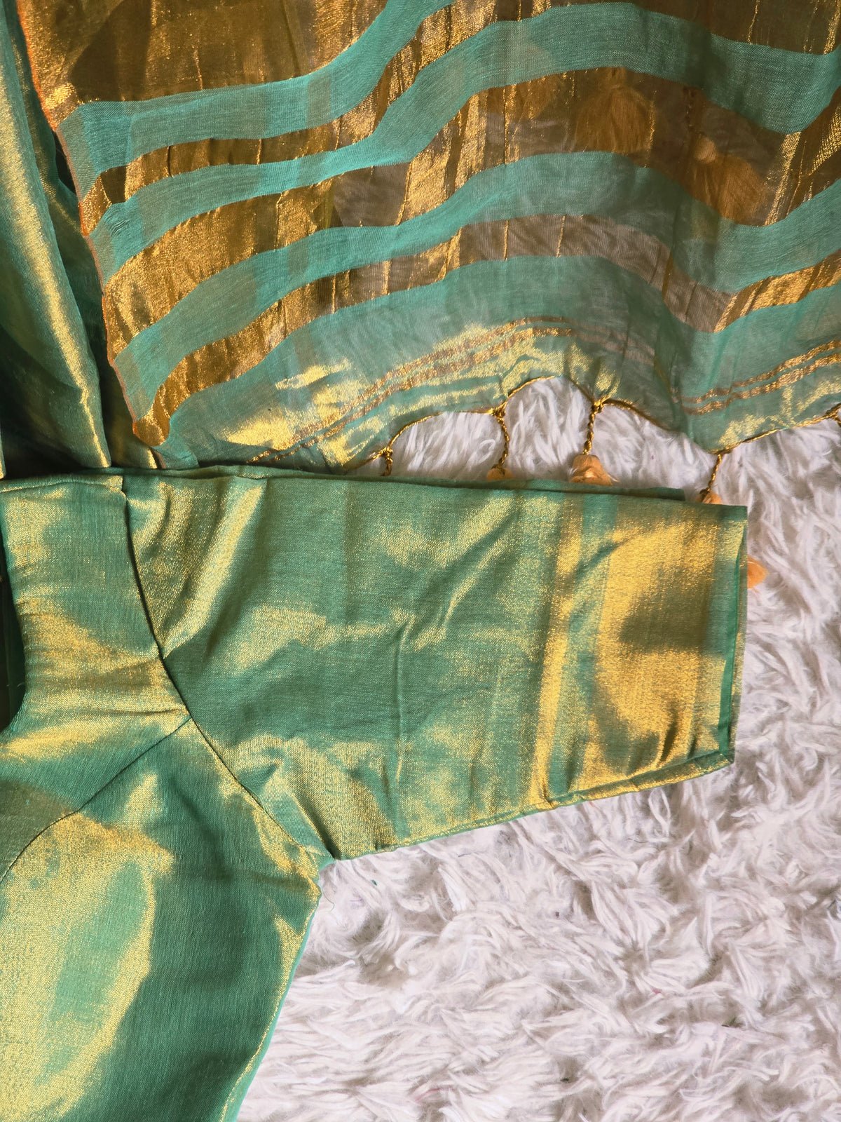 Semi tissue( pastel green)saree with stitched blouse ( elbow sleeve)