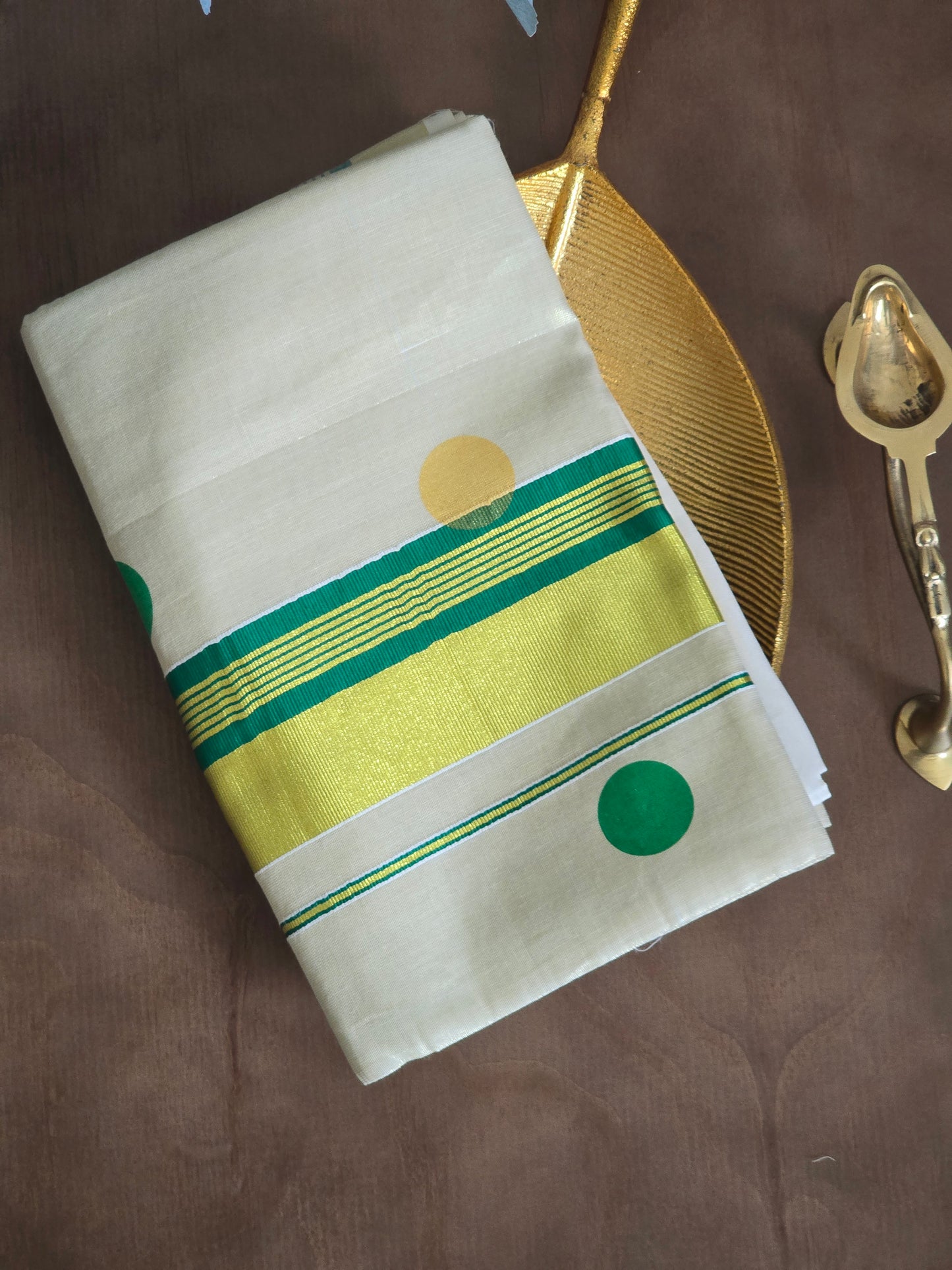 Tissue set saree with green and gold polka dots