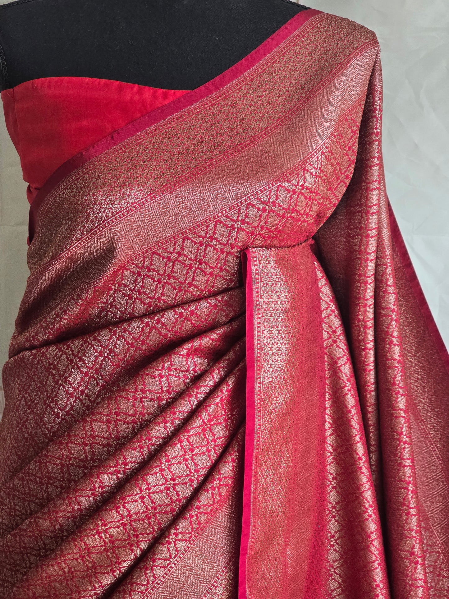 Reddish maroon semi katan brocade saree with stitched blouse