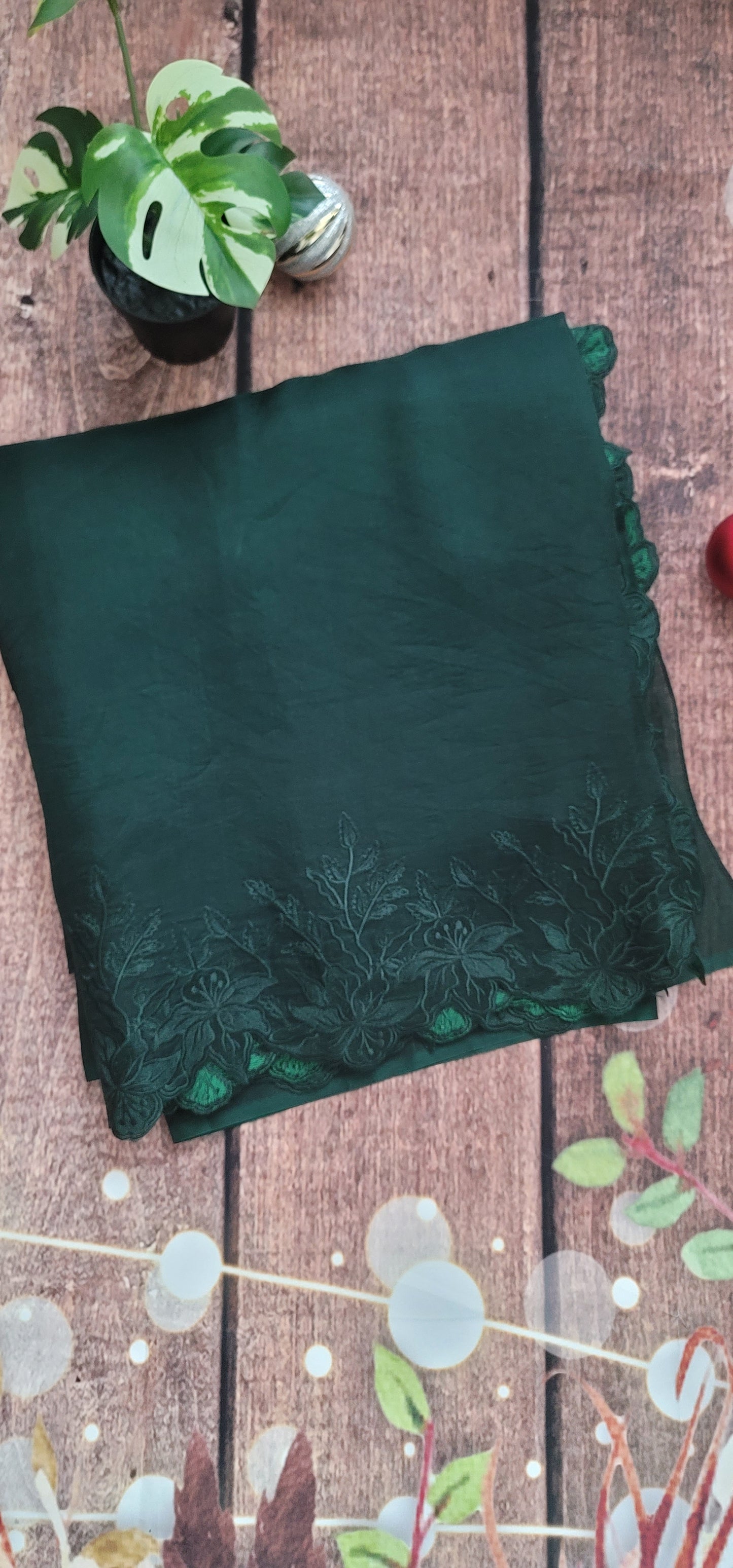 Dark bottle green organza saree with Scallop and Thread work with stitched blouse